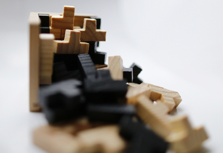 Wooden puzzle blocks on white backgroundの写真素材