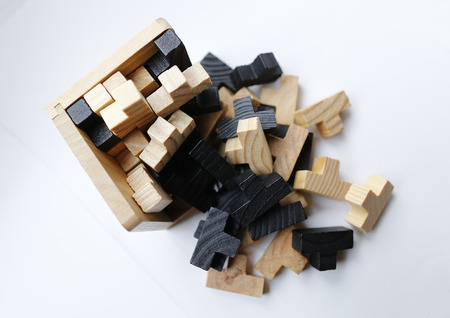 Wooden puzzle blocks on white backgroundの写真素材