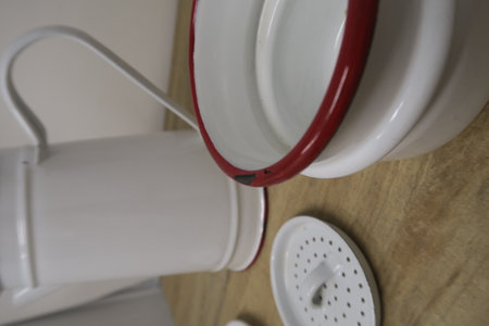 Close-up of teapot and cups on the kitchen table