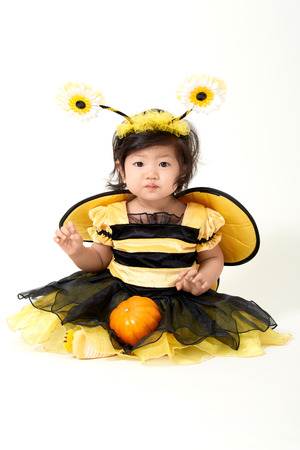 Baby wearing bee costume is ready for Halloweenの写真素材