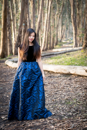 Girl posing in the forest for engagment photoの写真素材