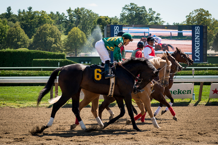 Horse jockey racing in Saratoga Springs of New York on Aug 2014.のeditorial素材