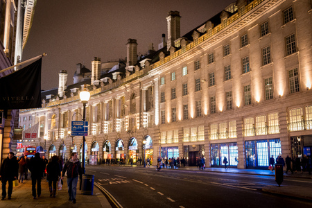Night view of Regent Street in London on Jan 2014. Regent Street is Londons busiest shopping neighborhood that attracts tourists all over the world.のeditorial素材