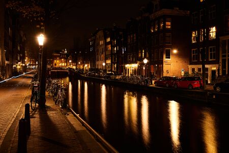 Amsterdam, Netherlands - November 2017: Illuminated canal bridge at night on the canal between Herengracht and Brouwersgracht. Amsterdan canal is one of the world famous sightseeing spot.のeditorial素材
