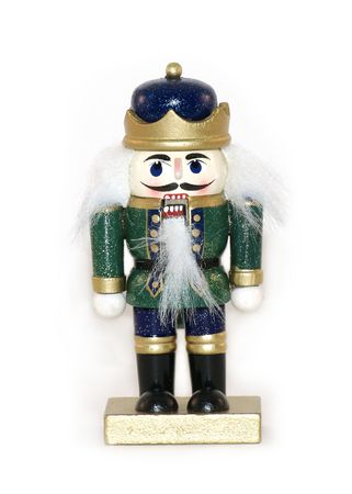A green Christmas nutcracker shot isolated against a white background.