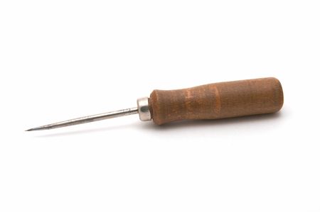 Sewed with the wooden handle on a white background 