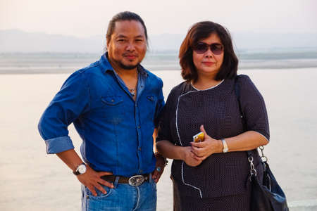 Zaw Win Htut - Burmese rock singer and his wife during a photocall at Bupaya Pagoda, Old Bagan, Myanmarのeditorial素材