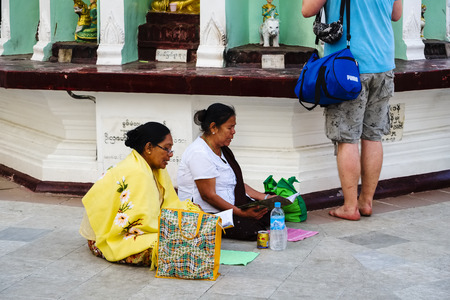 Praying women at Shwedagon Pagoda, Yangon, Myanmar