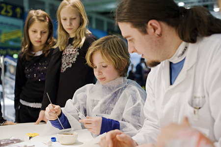 Children at the booth of the Federal Ministry for Education and Research, Green Week 2010, Berlin, Germanyのeditorial素材