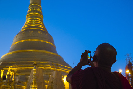 Monk at Shwedagon pagoda, Yangon, Myanmar, Asiaのeditorial素材