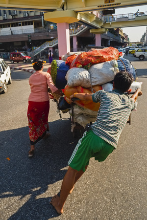 Street seller with hand cart, Yangon, Myanmarのeditorial素材
