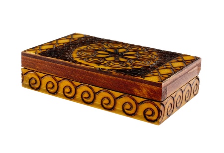 closed wooden box with coins isolatedの写真素材