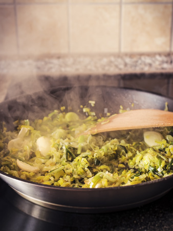 Leek and garlic on frying panの写真素材