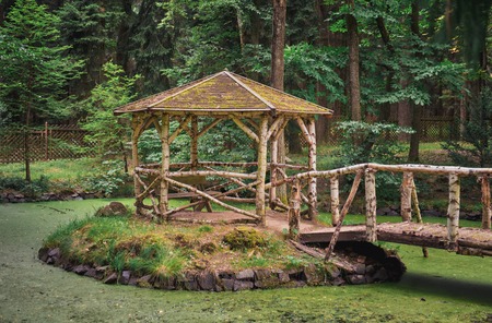 Rustical gazebo at Vysoka, Antonin Dvorak Memorial park in middle of small lakeの写真素材
