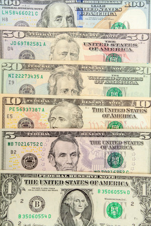 Close-up of US dollars arranged in sequence, capturing arrangement, visual contrast, and graphic...