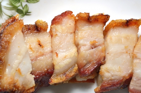 crispy pork cut on dishの写真素材