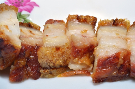 crispy pork cut on dishの写真素材