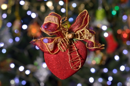 red heart with bow on the bokeh backgroundの写真素材