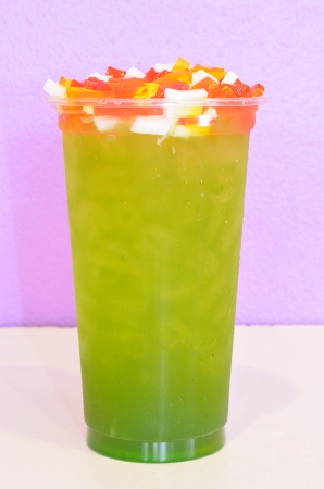 apple green tea in plastic cupの写真素材