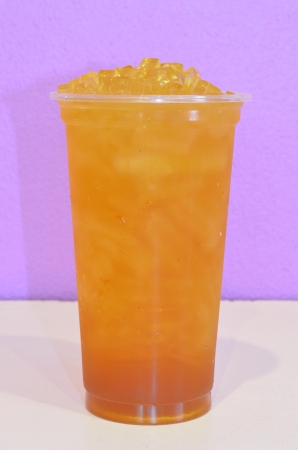 plum green tea in plastic cupの写真素材