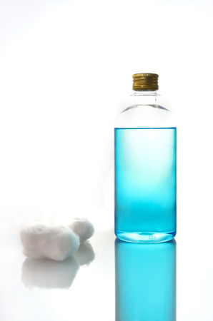 isopropyl alcohol bottle and cotton woolの写真素材