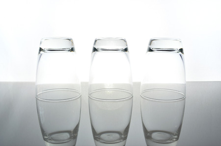 three empty glass invert の写真素材