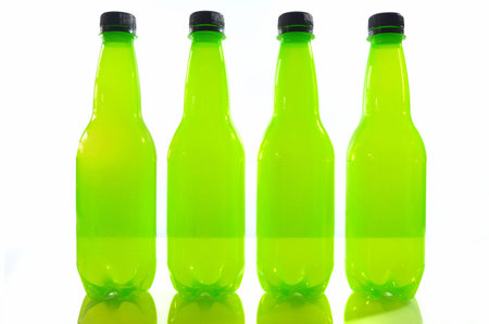 front green plastic bottle of soft drink on isolated の写真素材