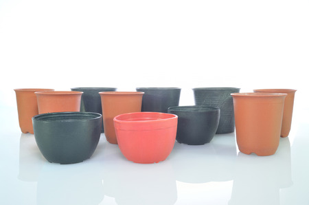 empty various plastic pots on isolated background