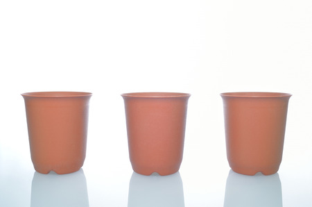 empty three plastic pots on isolated backgroundの写真素材