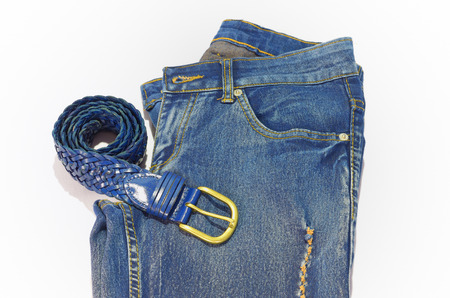blue mesh belt and jeans on white backgroundの写真素材