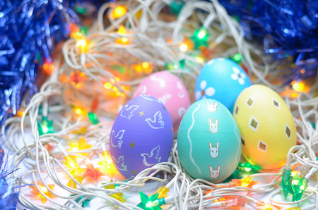 ester eggs on white wire and bulb background