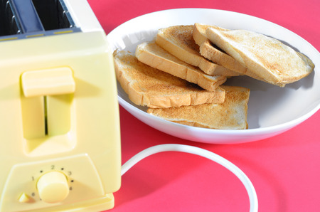 close up bread in white dish on red background