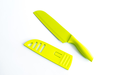 big green knife with sheath cover white background