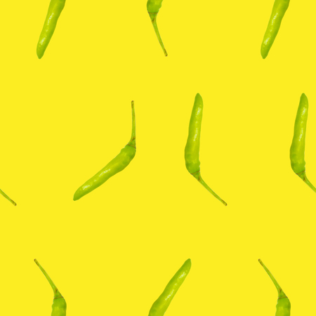 the green chili seamless pattern on yellowの写真素材