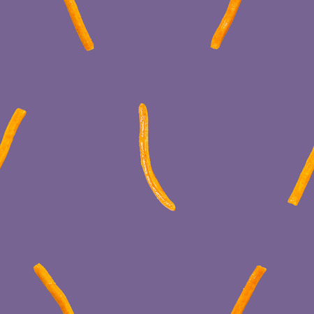 the crispy seasoned stick biscuit seamless pattern on purpleの写真素材