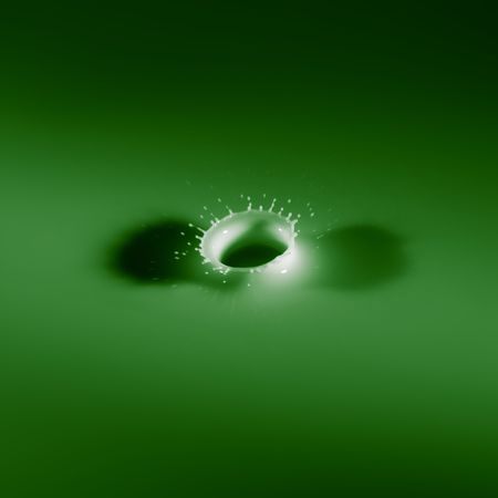 Abstract photos of milk droplets falling and captured on impactの写真素材