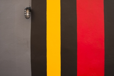 Old lamplight on the colorful wall backgroundの写真素材