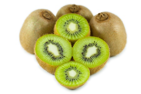 Ripe kiwi fruits with half isolated on white background の写真素材