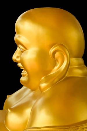 Closeup of laughing Buddha statue isolate on backの写真素材
