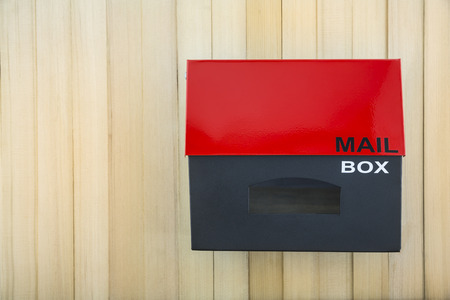 mailbox hanging on the wooden wallの写真素材