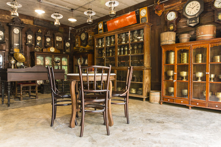 Wooden table with circular marble placed and circular wooden chair Chinese vintage style in antique show shopのeditorial素材