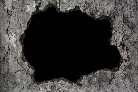 Scary background damaged grungy crack and broken concrete wall, concept of horror and Halloweenの写真素材