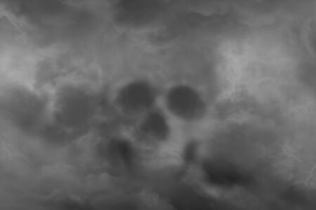 Scary skull from a cloud of smoke, concept of horror and Halloweenの写真素材