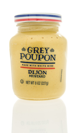 Winneconne, WI - 2 November 2016:  Jar of Grey Poupon dijon mustard on an isolated background.のeditorial素材