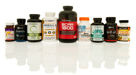 Winneconne, WI - 19 April 2017: Bottles of supplemts including GNC, Sports Research, Doctor's Best, Zhzou, and new chapter on an isolated background.のeditorial素材