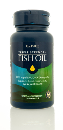 Winneconne, WI -1 August 2017:  A bottle of GNC triple strength fish oil on an isolated background.のeditorial素材