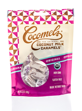 Winneconne, WI -  30 March 2018: A package of Cocomels coconut milk caramels candy on an isolated...