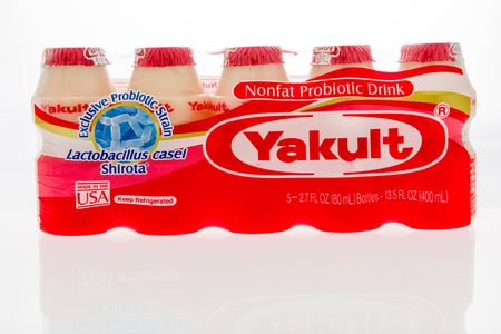 Winneconne, WI - 10 October 2018: A package of  Yakult nonfat probiotic drink on an isolated backgroundのeditorial素材