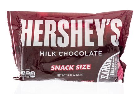Winneconne, WI -  12 April 2019: A bag of Twix Hersheys milk chocolate candy bars on an isolated...