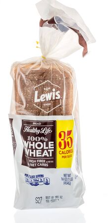 Winneconne, WI -  22 April 2019: A package of Bake Lewis shop whole wheat loaf bread on an isolated...